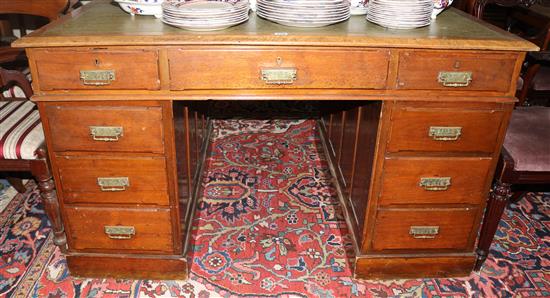 An Edwardian walnut partners desk, 136 x 115cms